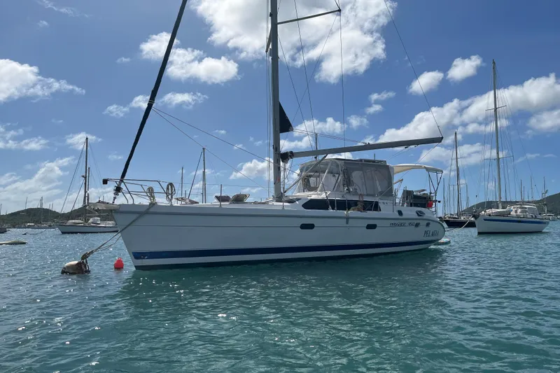 Pelagia Yacht Photos Pics Sailboat Hunter Passage 450, 1998 model, anchored in a sunny marina.