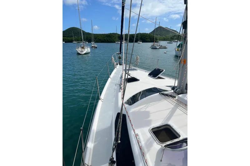 Pelagia Yacht Photos Pics Sailboat deck view of 1998 Hunter Passage 450 in a scenic harbor.