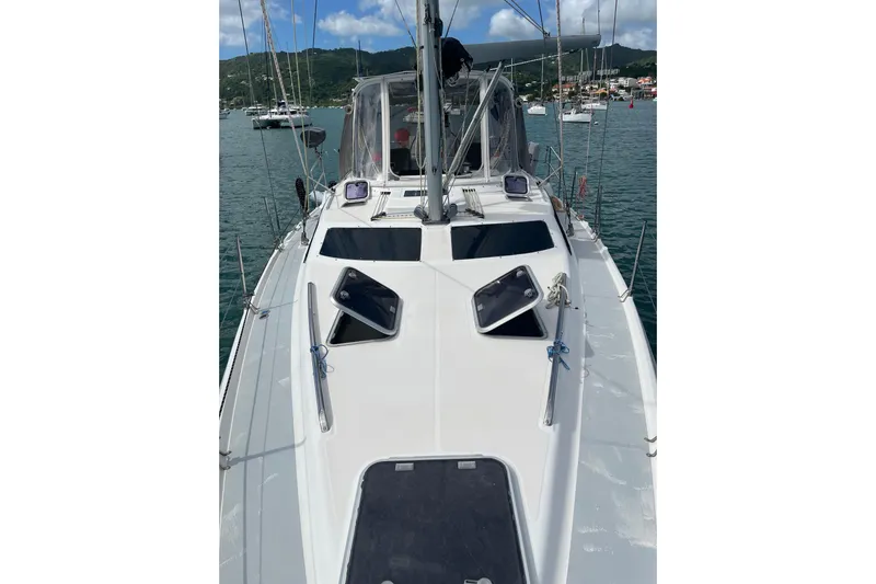 Pelagia Yacht Photos Pics 1998 Hunter Passage 450 sailboat on calm water, showcasing deck and hatches.