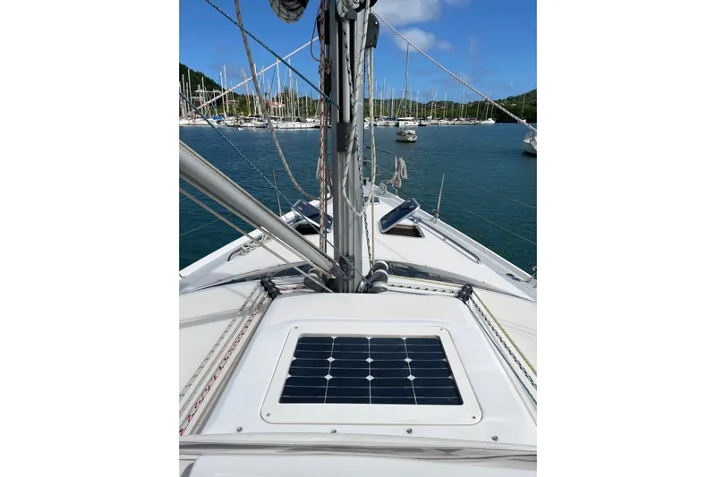 Pelagia Yacht Photos Pics Sailboat deck view with solar panel, Hunter Passage 450, 1998 model, anchored in marina.