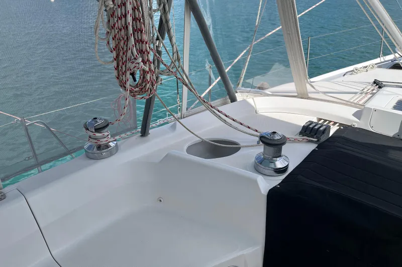 Pelagia Yacht Photos Pics Hunter Passage 450 sailboat deck with winches and ropes, 1998 model, on calm water.