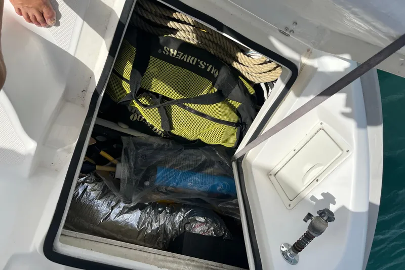 Pelagia Yacht Photos Pics Open storage compartment on 1998 Hunter Passage 450 sailboat, containing ropes and gear.