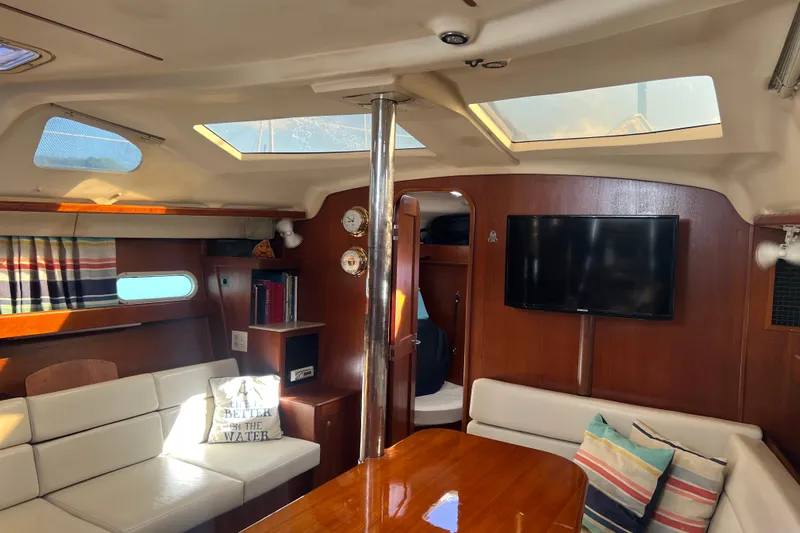 Pelagia Yacht Photos Pics Interior of 1998 Hunter Passage 450 yacht with cozy seating and modern amenities.