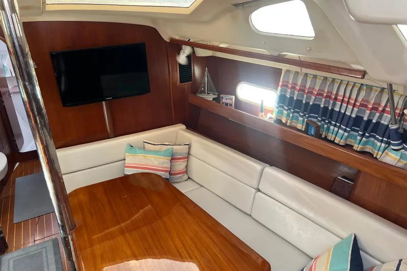 Pelagia Yacht Photos Pics Luxurious interior of 1998 Hunter Passage 450 yacht with cozy seating and modern amenities.