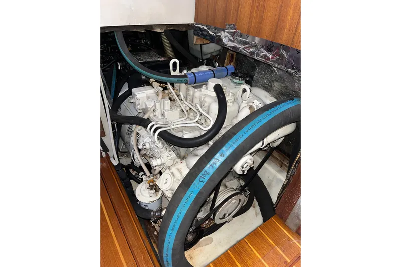 Pelagia Yacht Photos Pics Engine compartment of a 1998 Hunter Passage 450 sailboat, showcasing mechanical components.