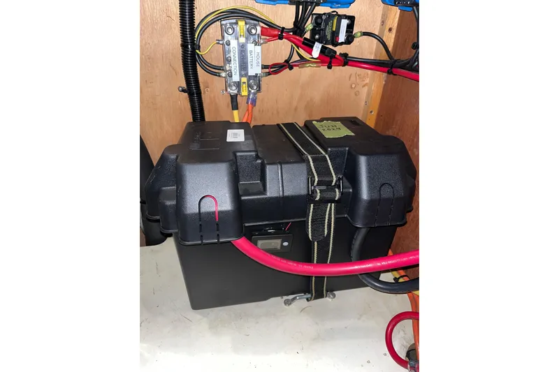 Pelagia Yacht Photos Pics Battery compartment of a 1998 Hunter Passage 450 sailboat with wiring and connections.