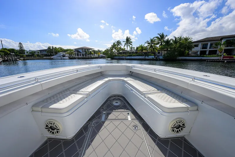 Denied Yacht Photos Pics Bow seating area of 2021 Yellowfin 42 boat, with waterfront view and clear skies.