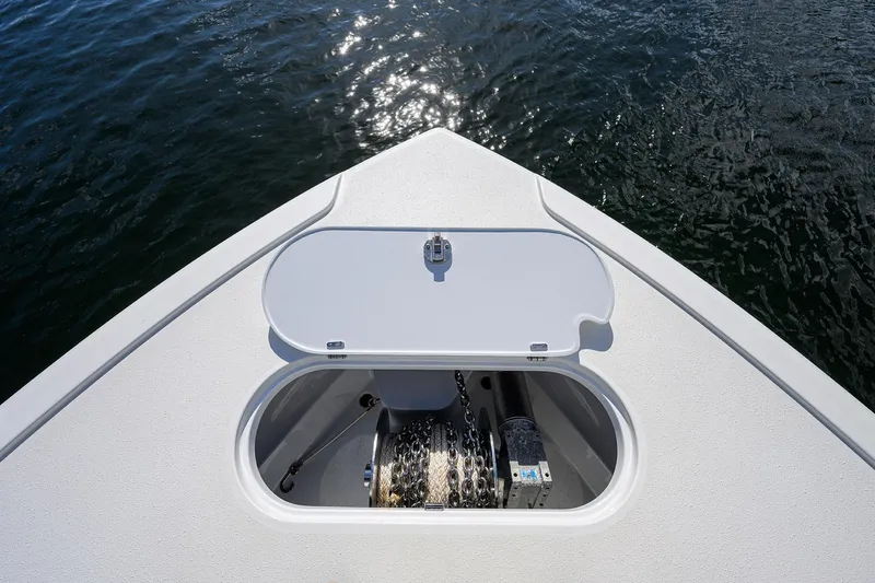 Denied Yacht Photos Pics Bow of 2021 Yellowfin 42 boat with anchor storage, on calm water.