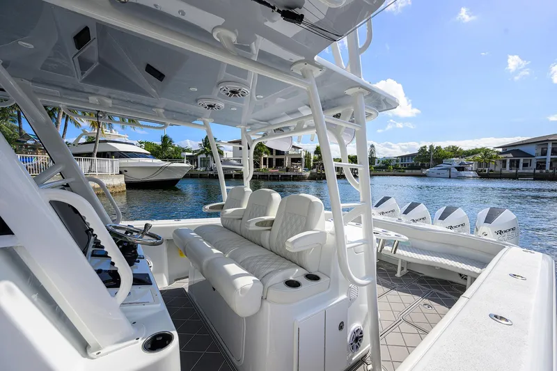 Denied Yacht Photos Pics 2021 Yellowfin 42 boat interior with luxurious seating and waterfront view.