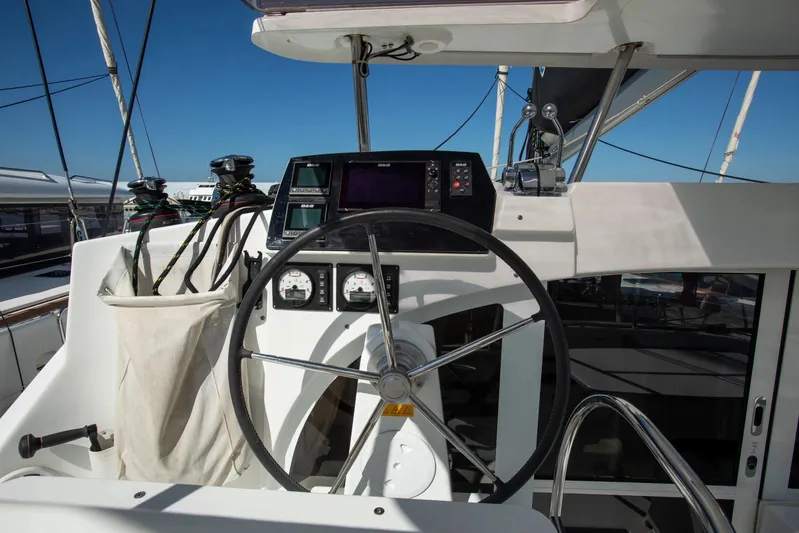  Yacht Photos Pics Steering wheel and controls of a 2019 Lagoon 380 catamaran yacht.