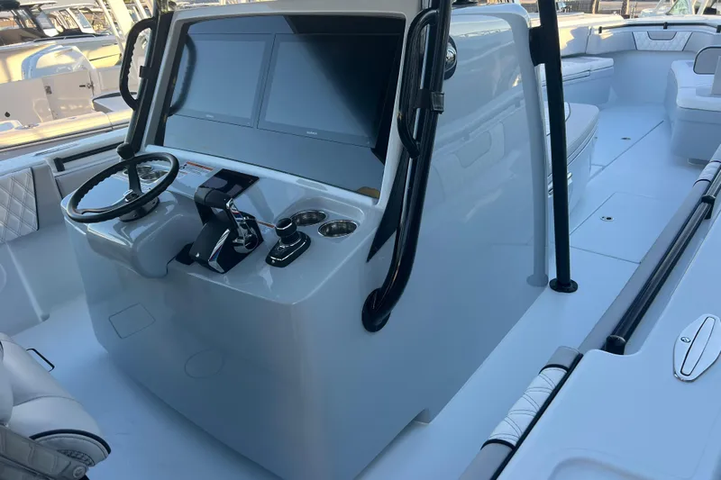  Yacht Photos Pics 2026 Contender 39 ST boat cockpit with modern steering and dual screens.