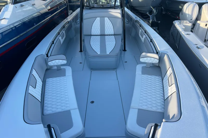  Yacht Photos Pics 2026 Contender 39 ST boat interior with white cushioned seating and sleek design.