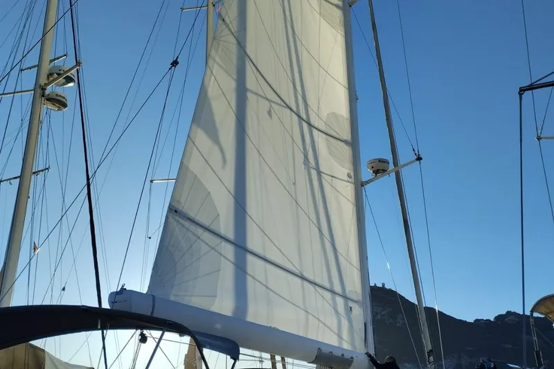 Ibubi Yacht Photos Pics Sail of 2010 Grand Soleil 54 yacht against clear blue sky.
