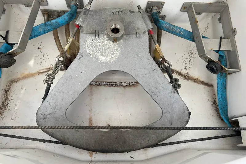 Ibubi Yacht Photos Pics Grand Soleil 54 sailboat steering mechanism, 2010 model, featuring metal components and blue hoses.