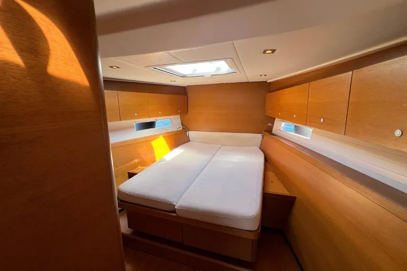 Ibubi Yacht Photos Pics Luxurious cabin interior of 2010 Grand Soleil 54 yacht with wooden finish and skylight.