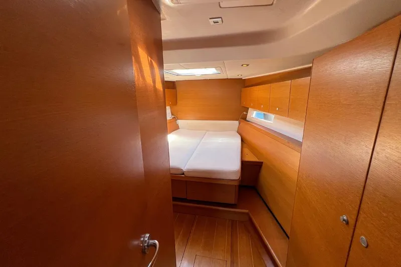 Ibubi Yacht Photos Pics Luxurious cabin interior of 2010 Grand Soleil 54 yacht with wooden finish.