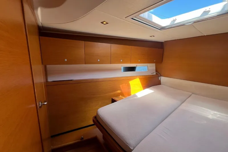 Ibubi Yacht Photos Pics Luxurious cabin interior of 2010 Grand Soleil 54 yacht with wooden finish and skylight.