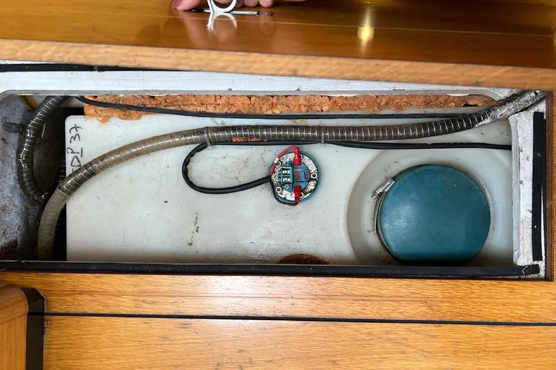 Ibubi Yacht Photos Pics Interior view of a 2010 Grand Soleil 54 yacht's compartment with wiring and components.