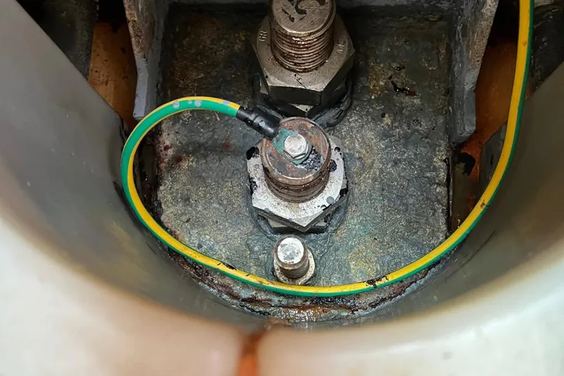 Ibubi Yacht Photos Pics Close-up of Grand Soleil 54 yacht's grounding bolt with yellow-green wire, 2010 model.