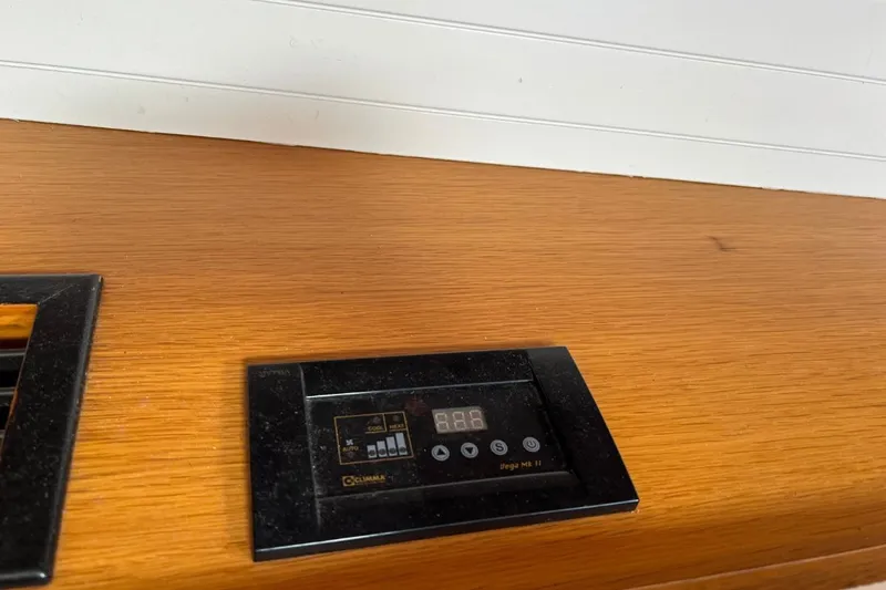 Ibubi Yacht Photos Pics Control panel on a 2010 Grand Soleil 54 yacht's wooden interior surface.