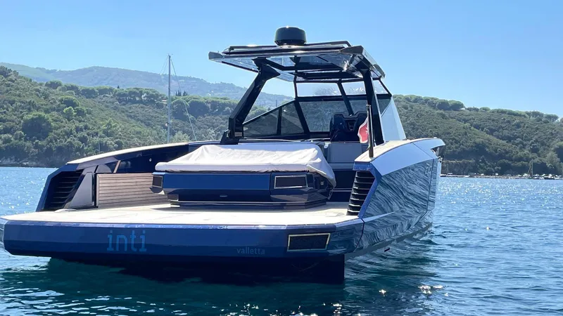  Yacht Photos Pics 2022 Evo Yachts R4 WA luxury yacht on serene water with scenic background.