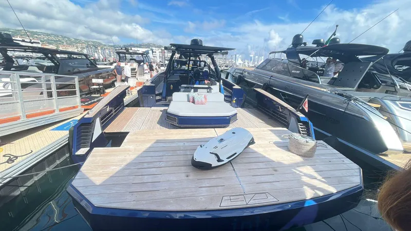  Yacht Photos Pics 2022 Evo Yachts R4 WA luxury yacht docked at marina, featuring spacious deck and modern design.