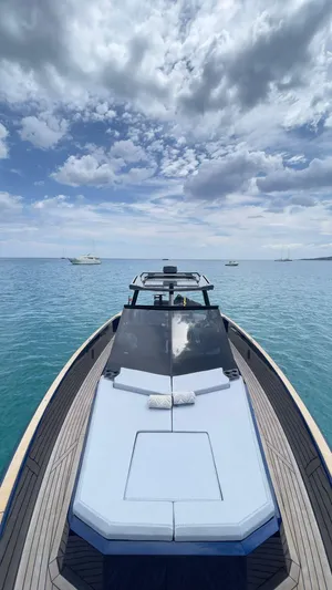  Yacht Photos Pics 2022 Evo Yachts R4 WA on serene blue waters under a cloudy sky.