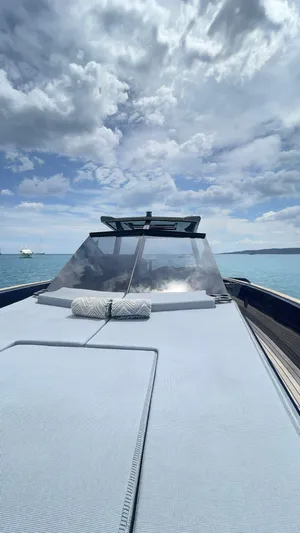  Yacht Photos Pics Evo Yachts R4 WA 2022 on serene ocean, under dramatic cloudy sky.