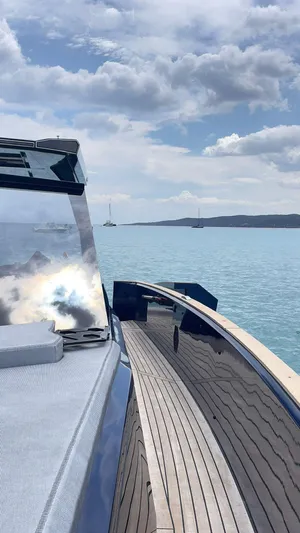  Yacht Photos Pics Evo Yachts R4 WA 2022 on serene blue waters under a partly cloudy sky.