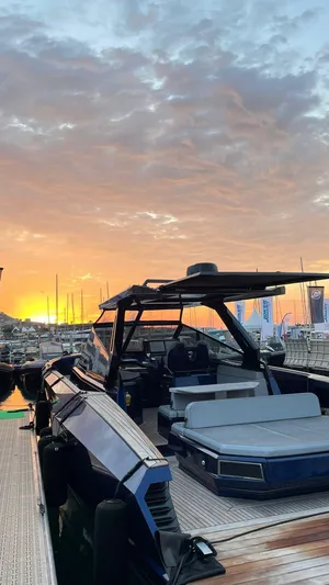  Yacht Photos Pics 2022 Evo Yachts R4 WA at sunset in marina, showcasing sleek design and luxury features.