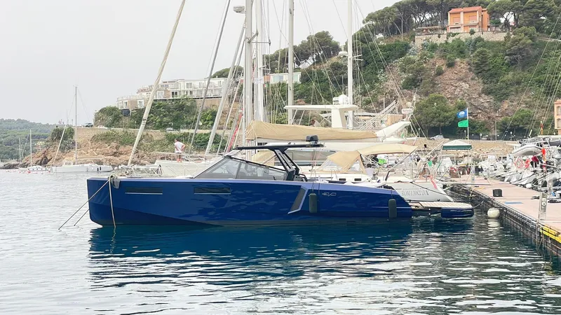  Yacht Photos Pics 2022 Evo Yachts R4 WA docked in a scenic marina setting.