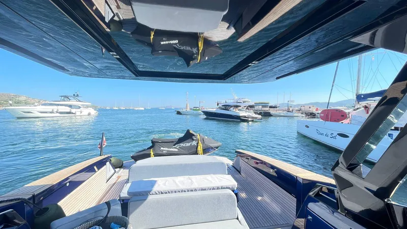  Yacht Photos Pics Luxurious Evo Yachts R4 WA 2022 on serene water, surrounded by other boats.