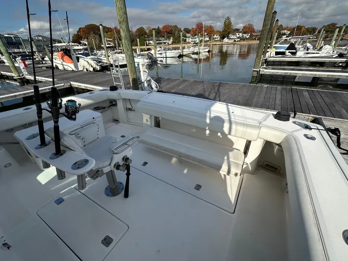  Yacht Photos Pics 2001 Tiara Yachts 4300 Open at marina, featuring spacious deck and fishing equipment.
