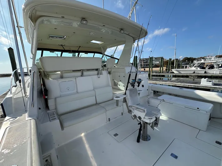  Yacht Photos Pics 2001 Tiara Yachts 4300 Open with spacious deck and fishing equipment at marina.