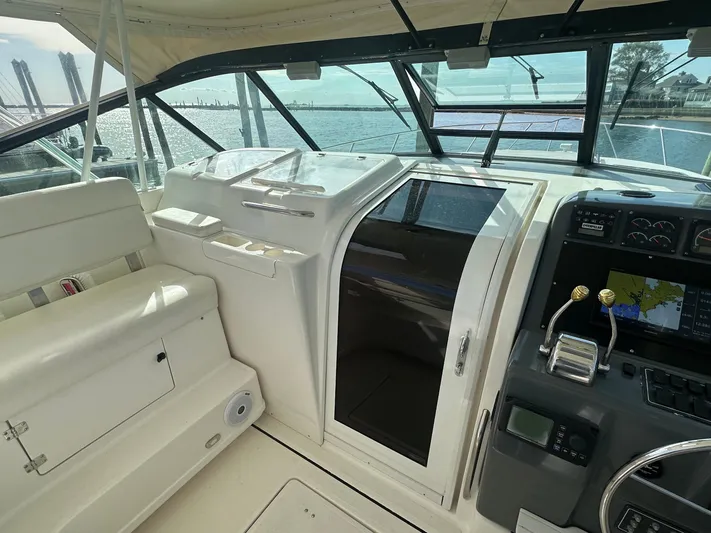  Yacht Photos Pics 2001 Tiara Yachts 4300 Open cockpit with helm, seating, and navigation equipment.