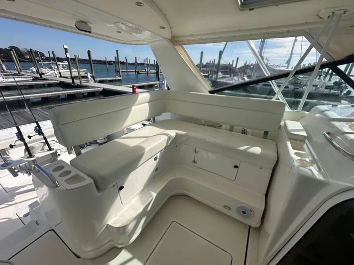  Yacht Photos Pics 2001 Tiara Yachts 4300 Open interior with white seating and marina view.