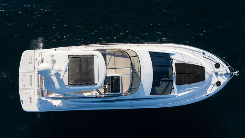 O-sea-d Yacht Photos Pics 2017 Sea Ray 51 Flybridge yacht, aerial view, cruising on dark water.