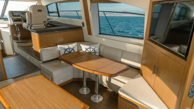 O-sea-d Yacht Photos Pics Luxurious interior of 2017 Sea Ray 51 Flybridge yacht with elegant seating and ocean view.
