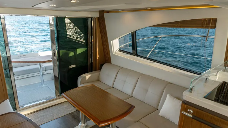 O-sea-d Yacht Photos Pics Interior of 2017 Sea Ray 51 Flybridge yacht with ocean view through window.