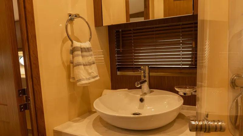 O-sea-d Yacht Photos Pics Luxurious bathroom interior of 2017 Sea Ray 51 Flybridge yacht with modern sink and towel.