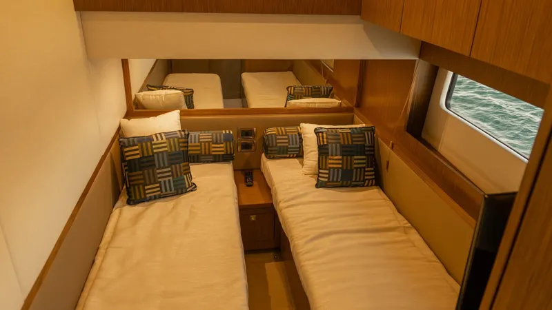 O-sea-d Yacht Photos Pics Luxurious twin cabin in 2017 Sea Ray 51 Flybridge yacht, featuring elegant bedding and window view.