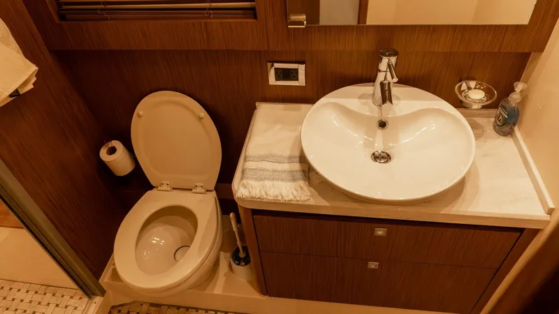 O-sea-d Yacht Photos Pics Luxurious bathroom in 2017 Sea Ray 51 Flybridge yacht with modern sink and toilet.