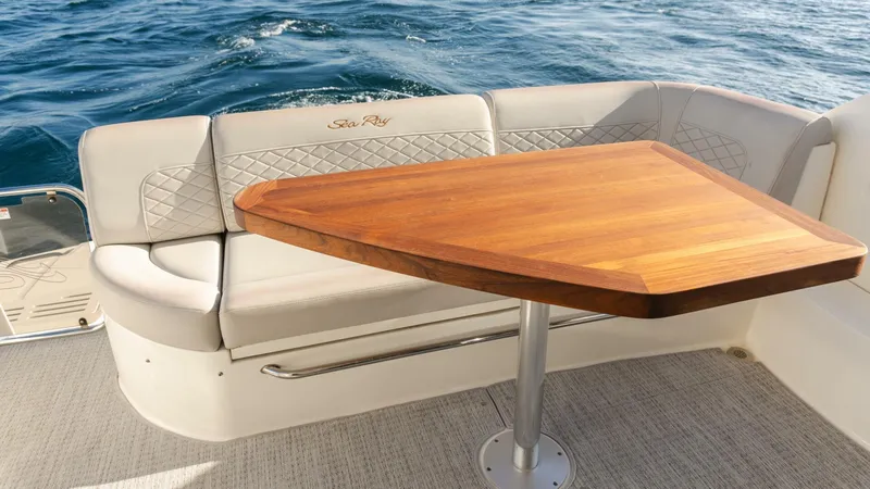 O-sea-d Yacht Photos Pics Luxurious seating area on 2017 Sea Ray 51 Flybridge yacht with wooden table.