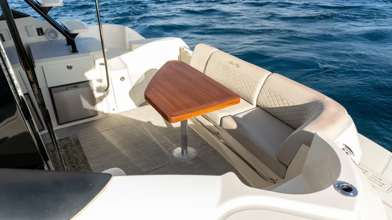 O-sea-d Yacht Photos Pics 2017 Sea Ray 51 Flybridge yacht with elegant outdoor seating and wooden table.