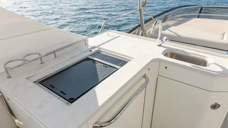 O-sea-d Yacht Photos Pics Outdoor kitchen on 2017 Sea Ray 51 Flybridge yacht with sink and cooktop.