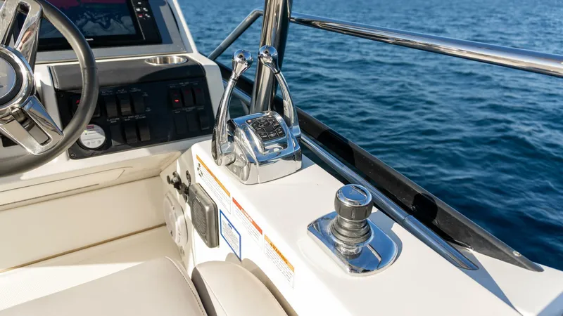 O-sea-d Yacht Photos Pics 2017 Sea Ray 51 Flybridge helm with controls, overlooking blue ocean waters.