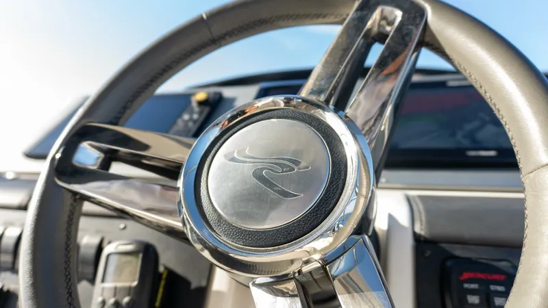 O-sea-d Yacht Photos Pics Steering wheel of 2017 Sea Ray 51 Flybridge yacht, showcasing luxury design.