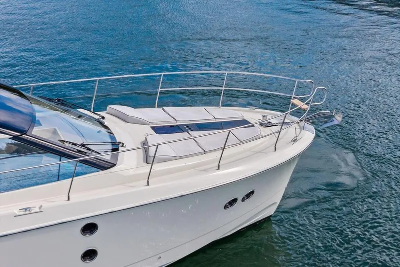  Yacht Photos Pics 2018 Monte Carlo MC 35 yacht on calm blue water, showcasing sleek design and luxury features.