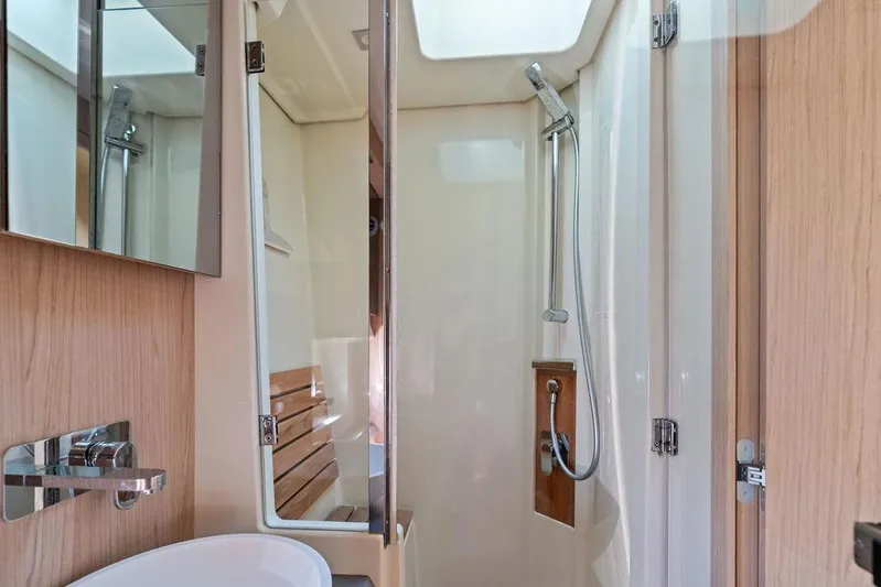  Yacht Photos Pics Luxurious bathroom interior of 2018 Monte Carlo MC 35 yacht with modern shower and fixtures.