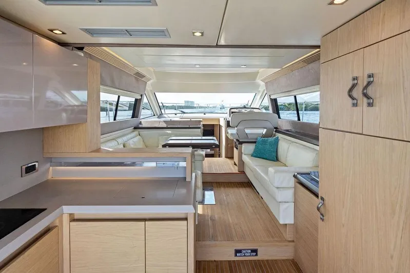  Yacht Photos Pics Luxurious interior of 2018 Monte Carlo MC 35 yacht with modern design and wood finishes.